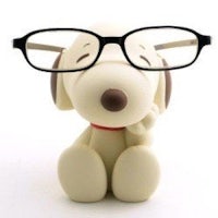 a toy dog with glasses on his head