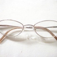 a pair of eyeglasses on a white surface